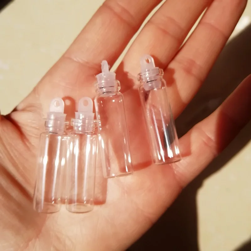 Download 700 x 2ml Clear Glass Bottle with White Plastic Stoppers 11*35mm Plastic Lid Small Glass Vials ...