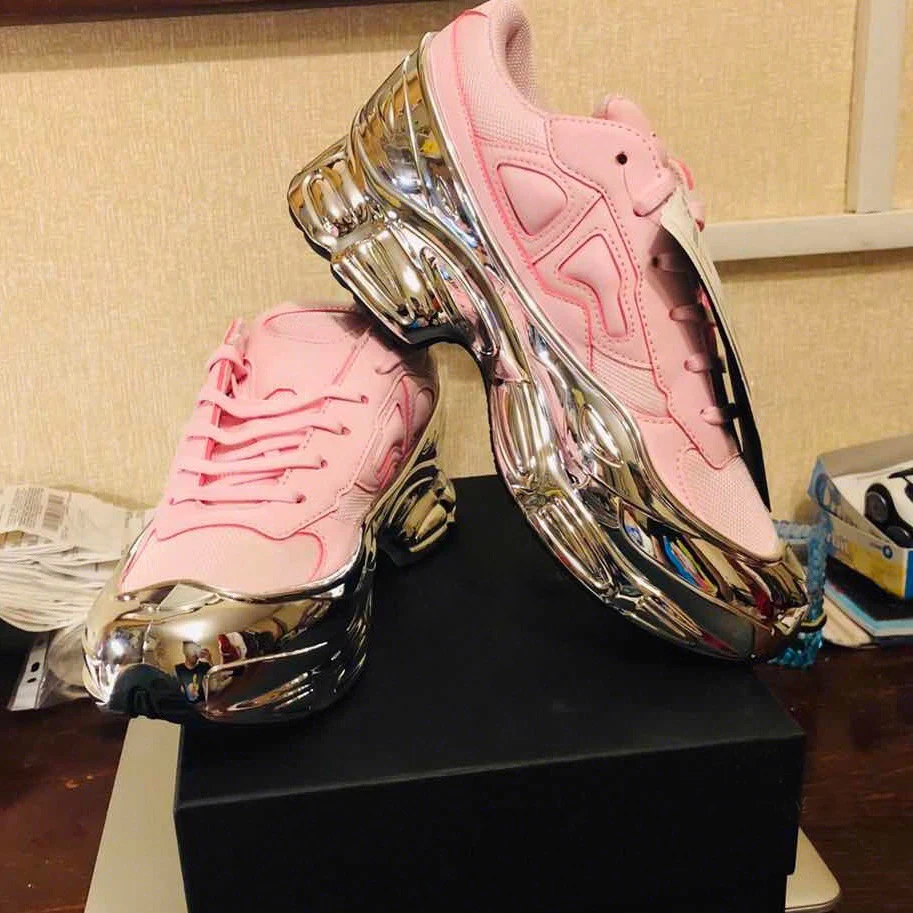 pink sneakers with silver bottom