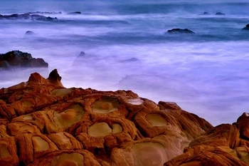 

Quality Cotton canvas printed painting from Nuture photo of Special rock on seaside near the beautiful sea shrouded by Smoke