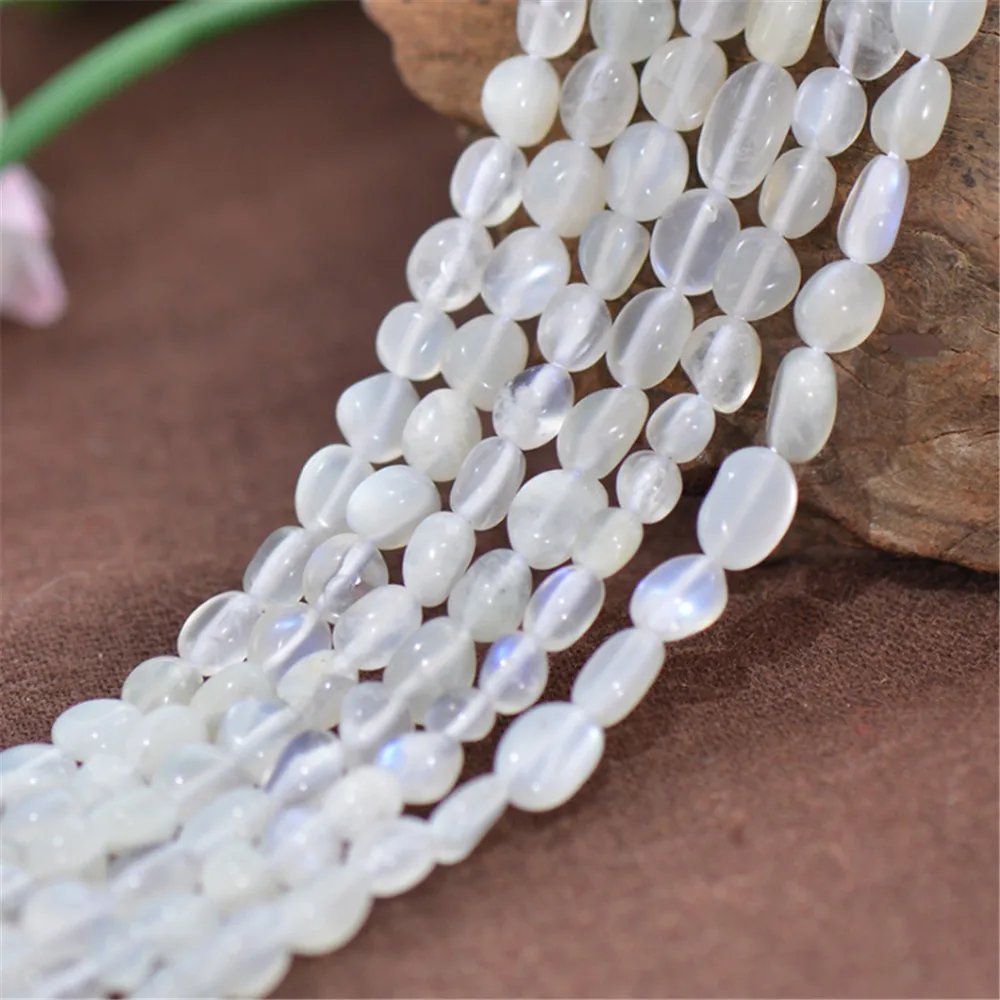 

Joanlyn Grade A Natural Rainbow Moonstone Blue Luster White Moonstone Irregular Beads Smooth Polished Round 15 Inch Strand MD93
