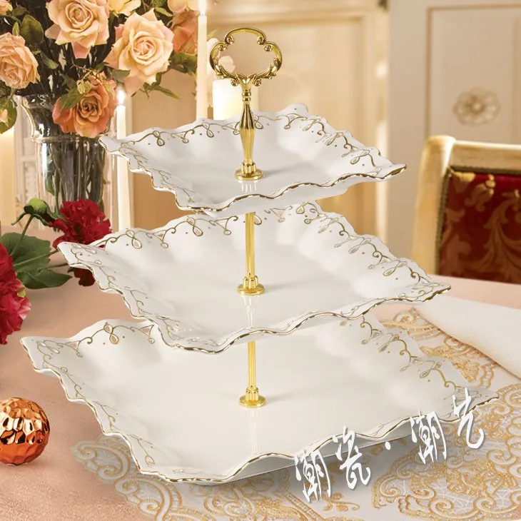 الأوروبي طبقة ثلاثة مربع السيراميك الكومبوت. الراقية فنادق غرفة الجلوس طاولة الشاي الفاكهة السلطانية. الإبداعي الأزياء مكان كبير الأوروبي طبقة ثلاثة مربع السيراميك الكومبوت. الراقية فنادق غرفة الجلوس طاولة الشاي الفاكهة السلطانية. الإبداعي الأزياء مكان كبير