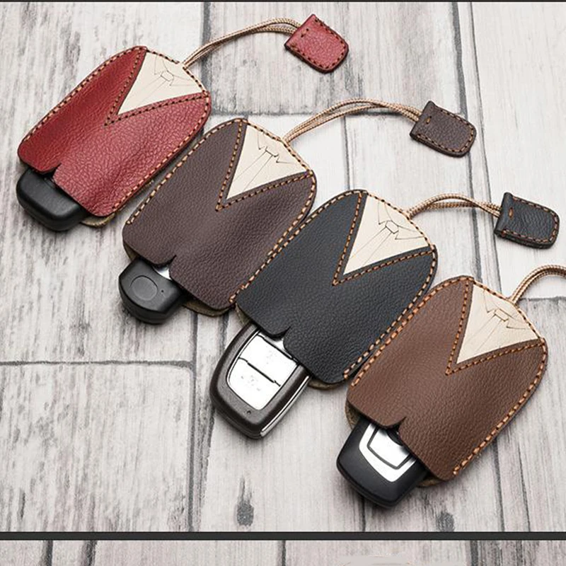 

New Design High Quality Genuine Cowhide automobile car Key Wallet Rope Pulling type Style Key Storage Bag Key Car Case for Car
