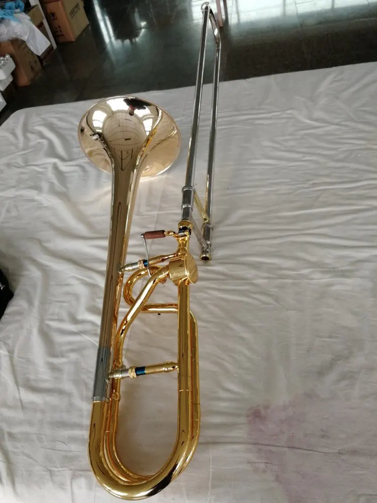 

Brass Musical instruments Schagerl trombone H85 Brass Real gold plated Tenor Trombone customs Hand hammered Bell with case