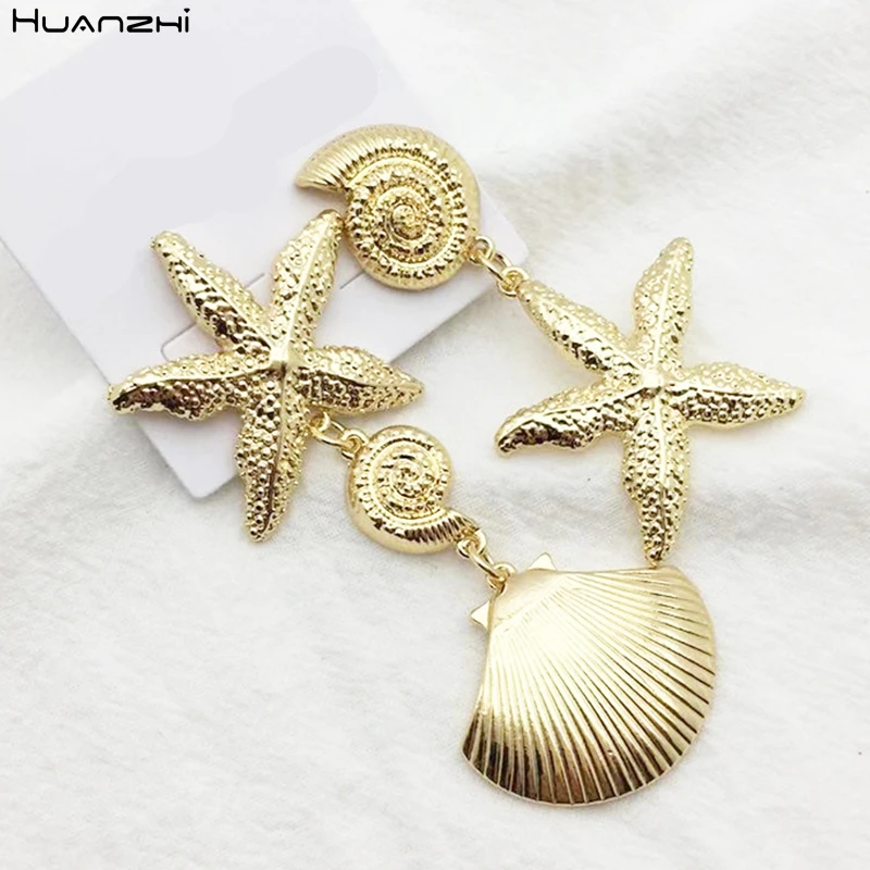 

HUANZHI Asymmetry Starfish Cowrie Shell Gold Color Metal Personality Design Drop Earrings For Women Travel Beach Jewelry