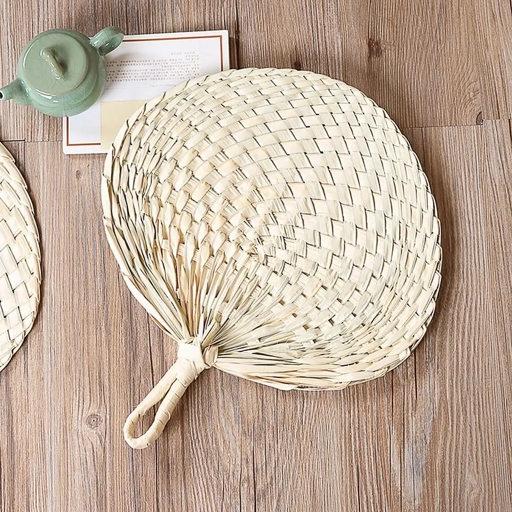 

Chinese Rural Folk Custom Style Handmade Fan Natural Hand Weaving Palm Leaf Fan Blades Portable Cooling Fan For Camping Hiking