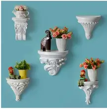 Cheap Continental shelf on the wall of carve patterns or designs on woodwork. Resin hanging rack. Decorative frame. Cheap Continental shelf on the wall of carve patterns or designs on woodwork. Resin hanging rack. Decorative frame.
