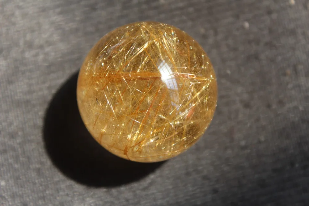 

Natural rutilated quartz crystal ball