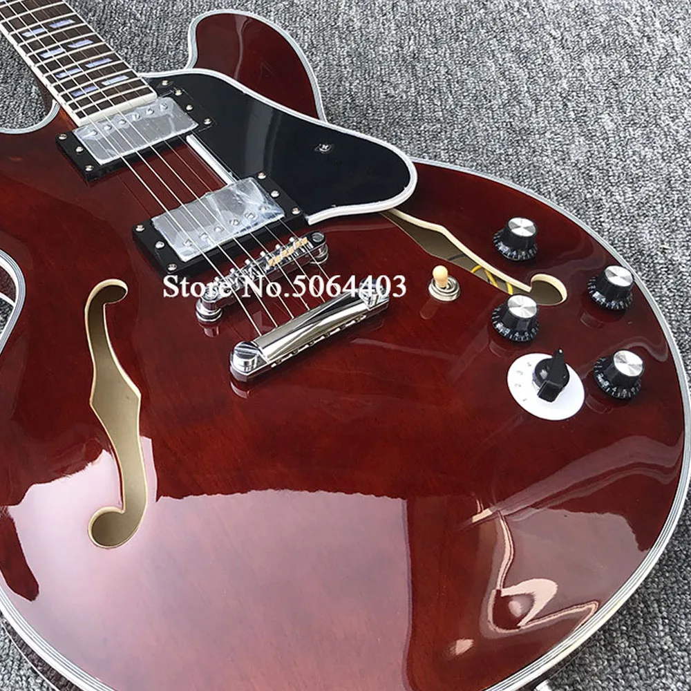 

High-quality 6-string electric guitar, half-empty core electric guitar, with F-hole. 6-gear switch, multi-layer wrapping, postag