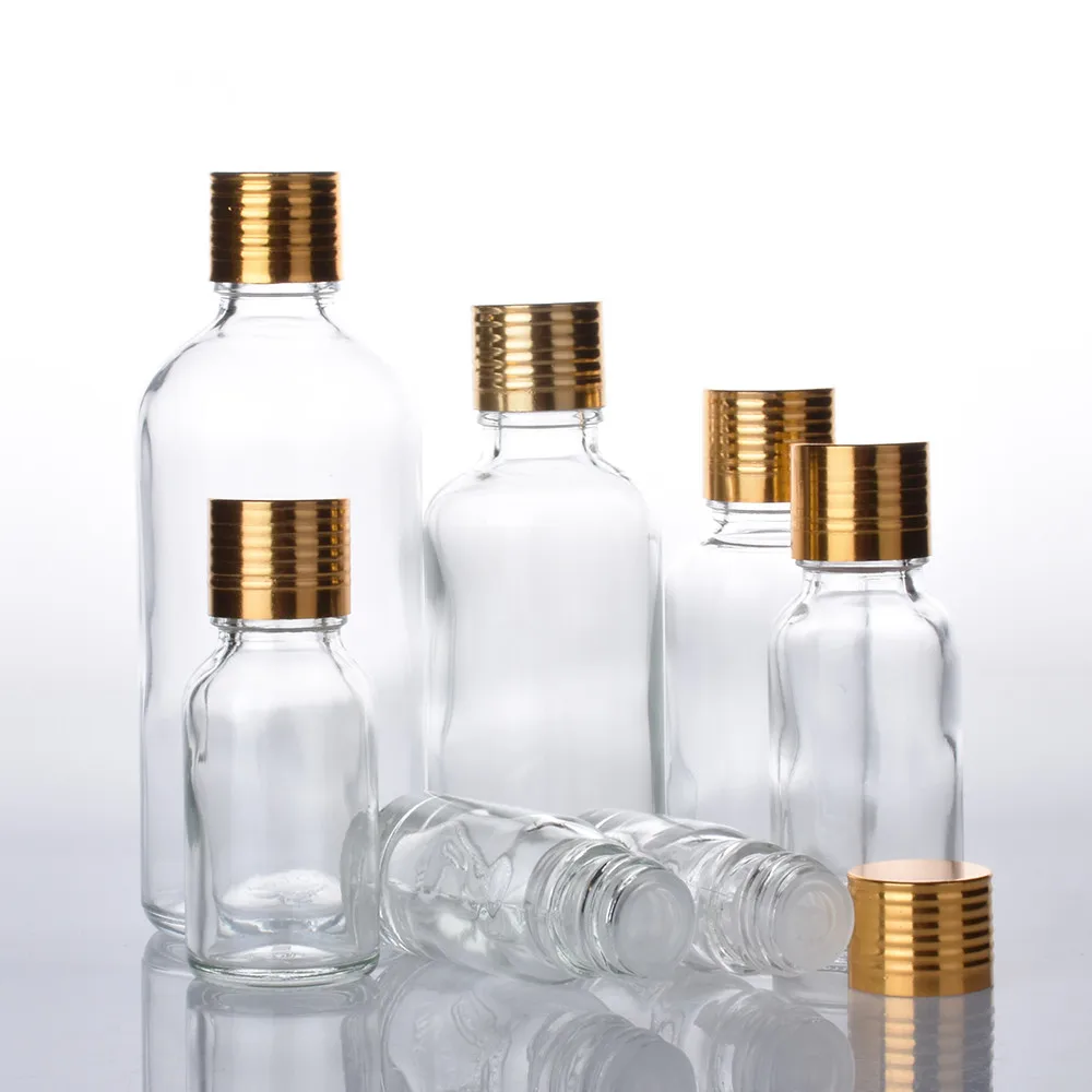 

12pcs/lot 5ML 10ML 15ML 20ML 30ML 50ML 100ML Clear Boston Round Glass Essential Oil Bottle Orifice Reducer Gold Aluminum Cap
