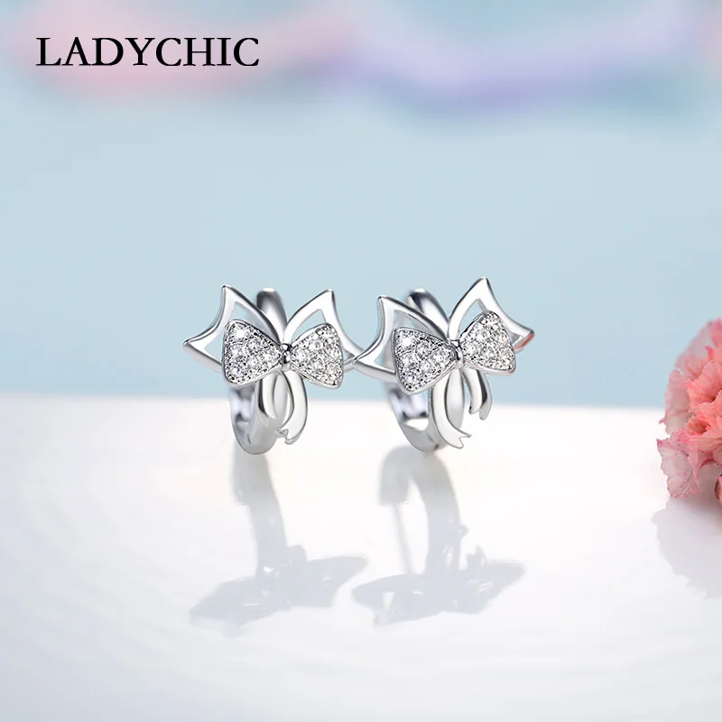 

LADYCHIC Presents Silver Sparkling Bowknot Stud Earrings Inlay Clear CZ Stone Cute Small Earring Jewelry for Women LE1023