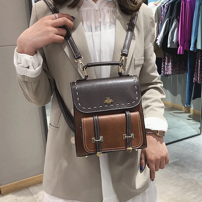 

Korean version of lady's shoulder bag 2018 new collision color PU mini-multi-purpose lady's small backpack fashion 100-pack