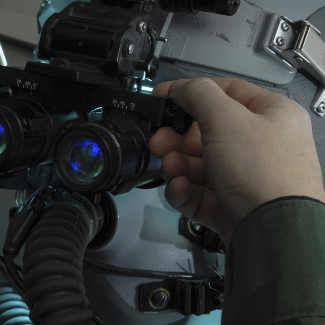 Airman adjusts the eyespan on a pair of night vision goggles Poster Print (16 x 11)
