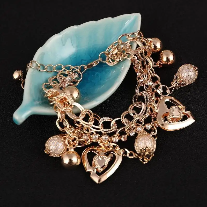 

Hesiod Fashion Temperament Exaggerated Exquisite Rhinestone Gold Color Bracelet Beads Pierced Heart Tassel Pendant Bracelets