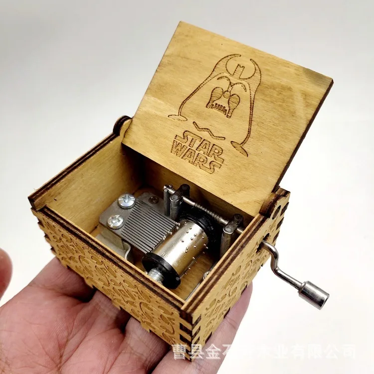 Manufacturers direct sales solid wood laser carving hand-operated music box Star Wars gift wooden handmade octave box