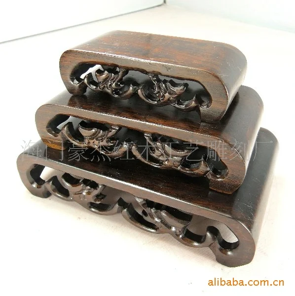 

A set of three black wooden African Ebony Wood mahogany base base jade stone base