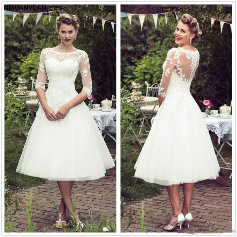 Vintage 50's Stijl Korte Kant Trouwjurken Half Mouwen Tule Kant Applique Thee Lengte Bridal Bruidsjurken met Knoppen Vintage 50's Stijl Korte Kant Trouwjurken Half Mouwen Tule Kant Applique Thee Lengte Bridal Bruidsjurken met Knoppen