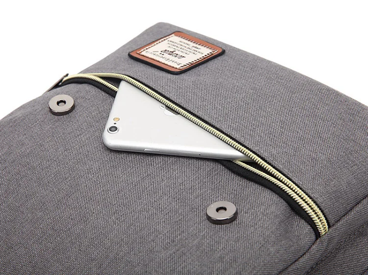 a photo of a tablet inside a grey backpack