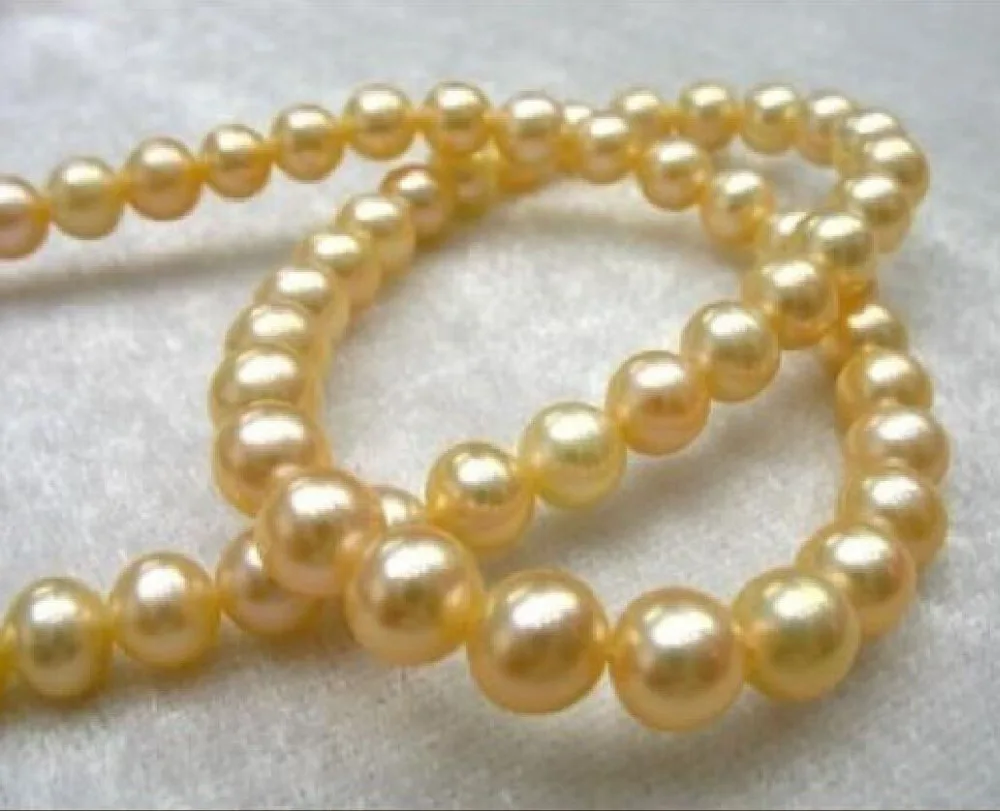 

Free Shipping >>>charming south sea AAA 10-11mm golden pearl necklace 18" 14K yellow clasp