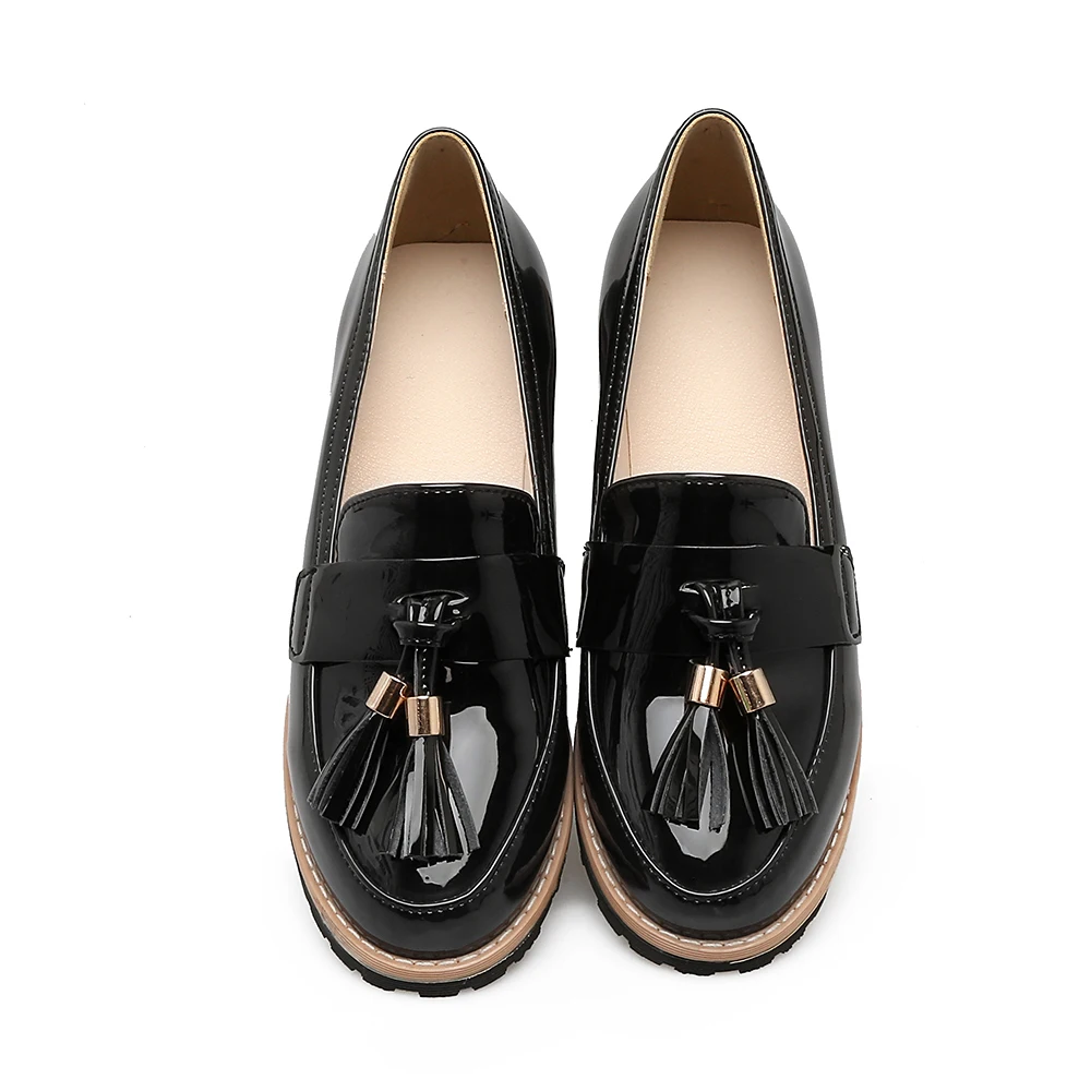 black flats with tassels