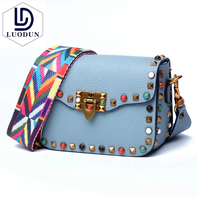 

New ladies colored rivets small square bag Europe and the first layer of leather Messenger bag wide shoulder strap shoulder bag