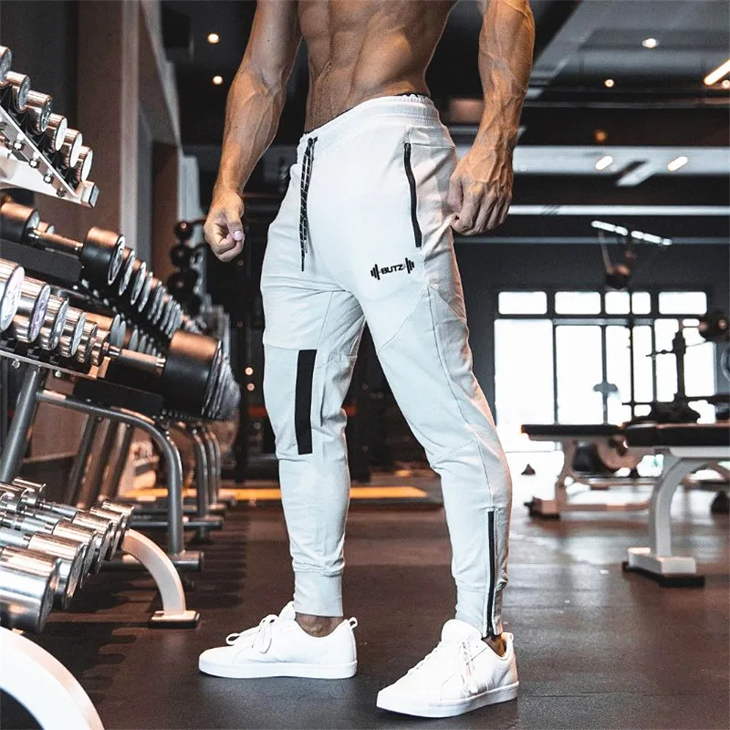 

2019 Men Autumn Cotton Long pants Male Gyms Fitness Casual Fashion sweatpants Joggers Bodybuilding Pants Skinny Brand Trousers