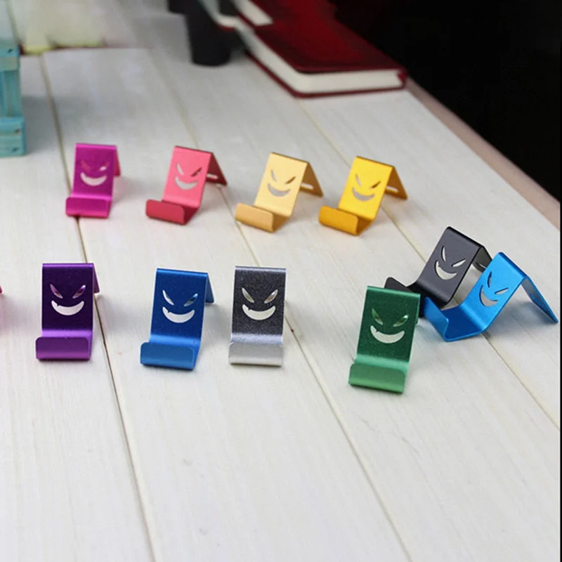 

1pcs Random Color Metal Devil Smile Universal Mobile Cell Phone Stand Holder