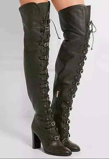 woman in black leather thigh high boots