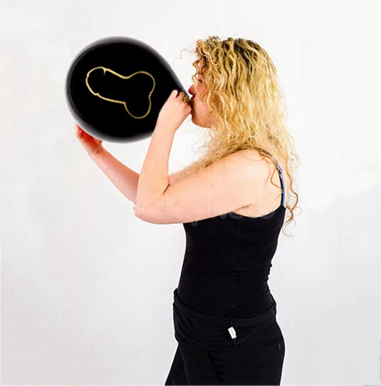 single-adult-female-blowing-up-a-medium-sized-red-balloon-fwccn3