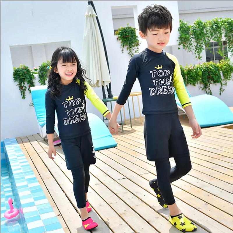 girl wearing boy swimsuit