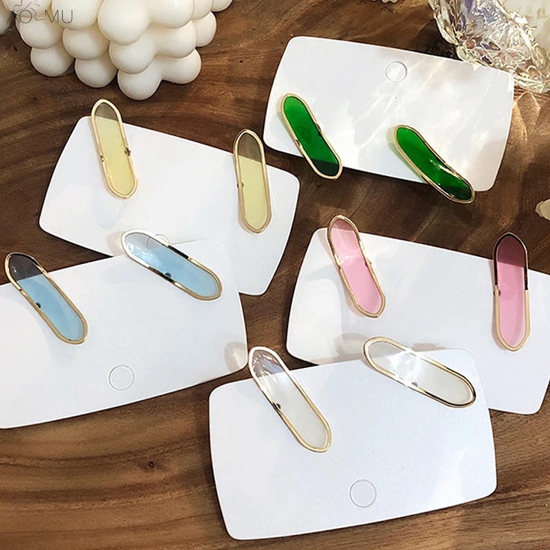 

AOMU 2019 New Korean Irregular Transparent Rainbow Color Metal Twist C Shape Stud Earrings for Women Girl Simple Party Jewelry