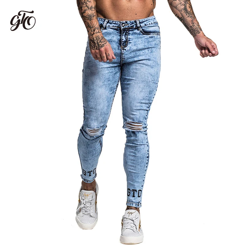 ripped tight blue jeans with the cuff