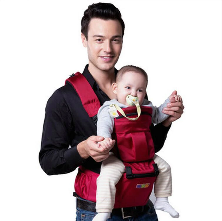 baby holding backpack
