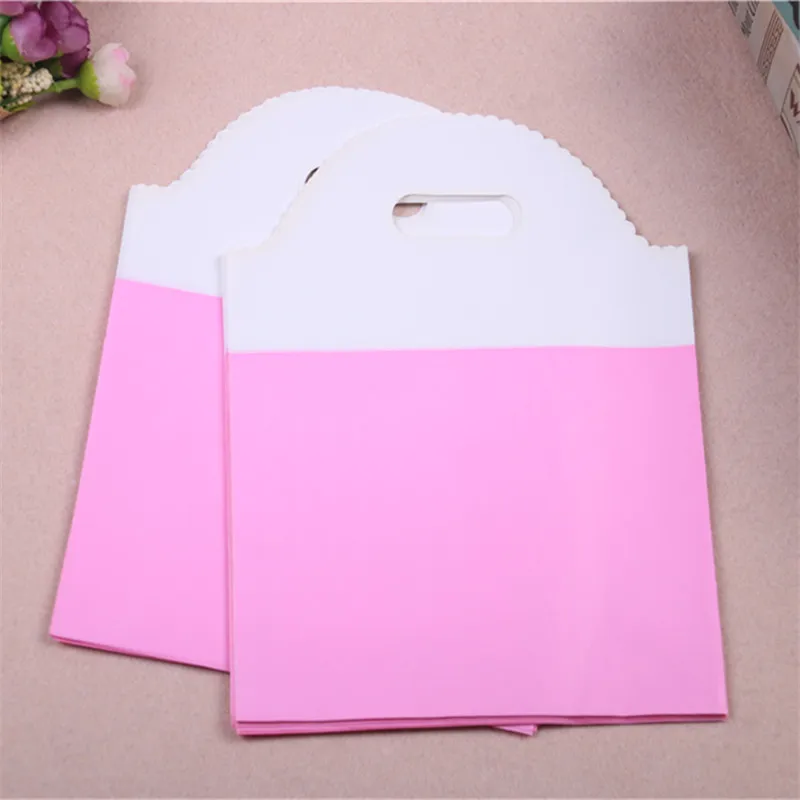 

New Design Wholesale 100pcs/lot 19*25cm Pink Luxury Clothing Packaging With Handles Simple Style Shopping Plastic Bags