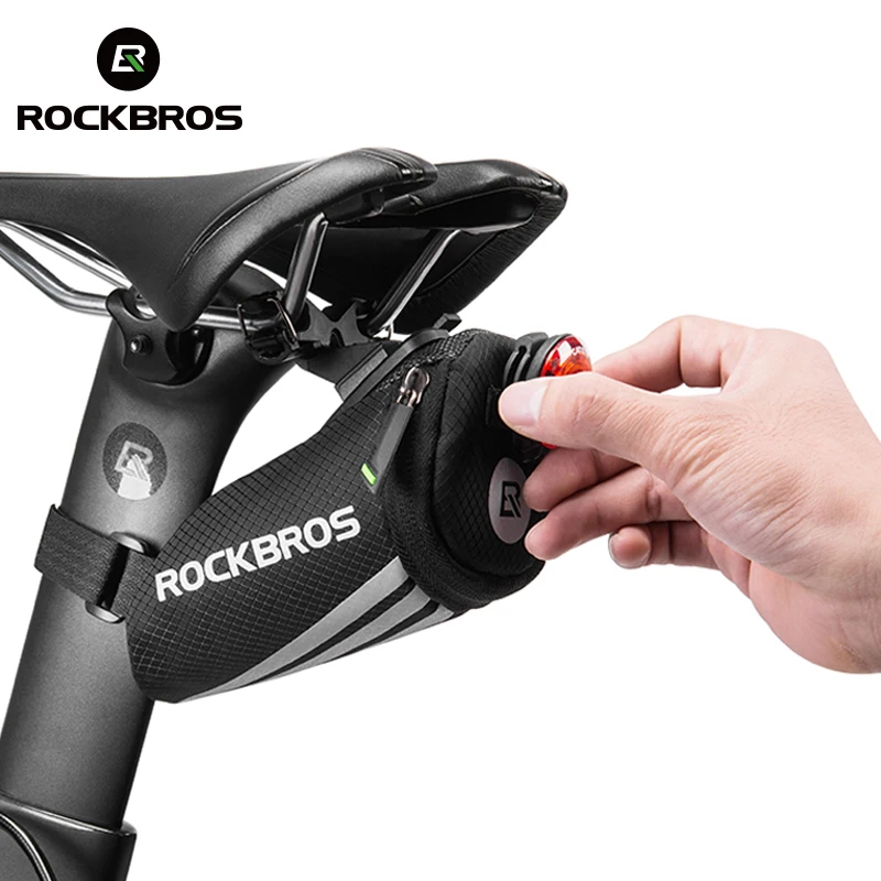 ROCKBROS Велоспортный велосипедный мини задний седло сумка портативный со светоотражателями для велосипеда хвост Подседельный штырь нейлонов... ROCKBROS Велоспортный велосипедный мини задний седло сумка портативный со светоотражателями для велосипеда хвост Подседельный штырь нейлонов...