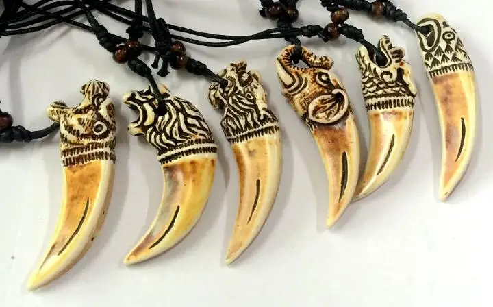 кулон клык plpl664. украшения из клыков. украшение клык. изделия из клыков. ожерелье из когтей.