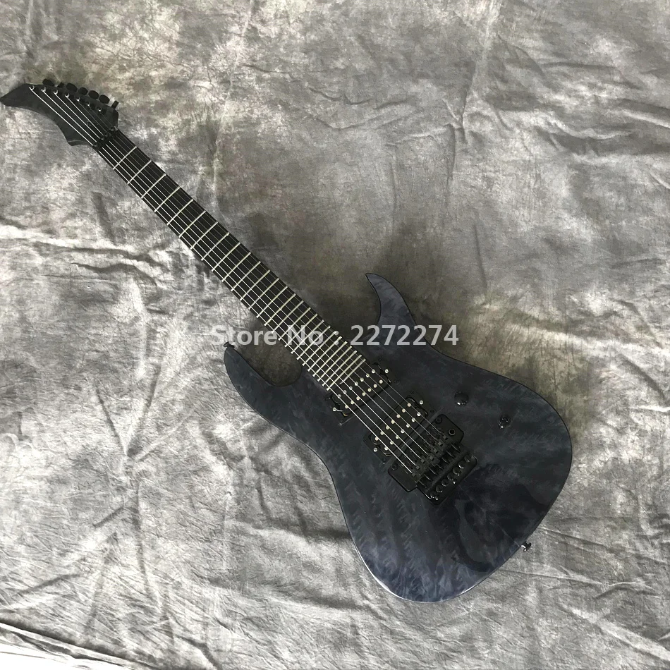 

New 7-string electric guitar, burst maple pattern. Delivery is available at home
