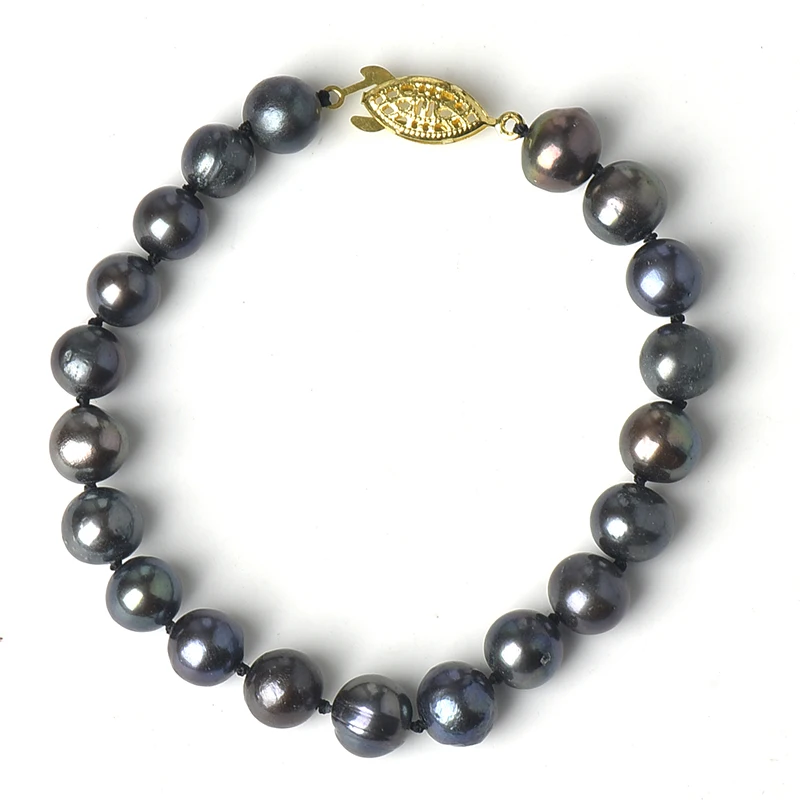 

7.5 inch Black Pearl Bracelet with Golden interface and Pure black gloss Smooth pearl .The Chic gift