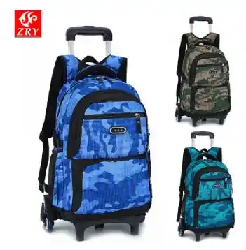 boy rolling backpacks for school
