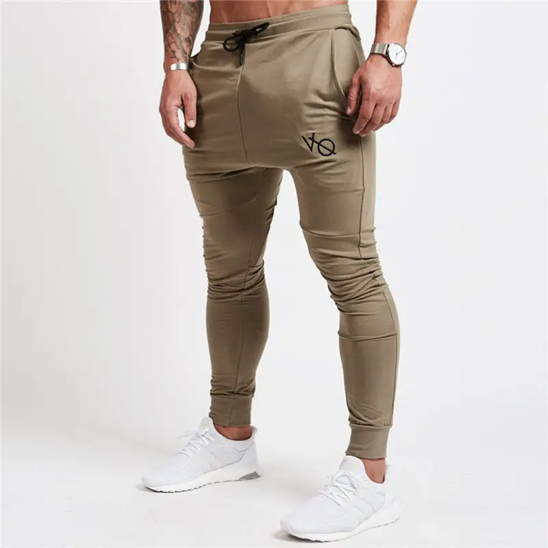 

Men New Fitness Bodybuilding Sweatpants male gyms Joggers workout cotton trousers Casual fashion Skinny sportswear Pencil pants