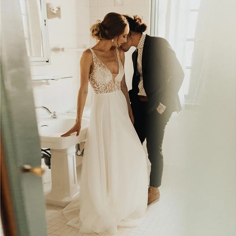 

Lakeydra Pearls Beach Wedding Dresses A-Line White Chiffon Deep V-Neck with Sleeveless Backless Long Plus Size Bridal Gowns