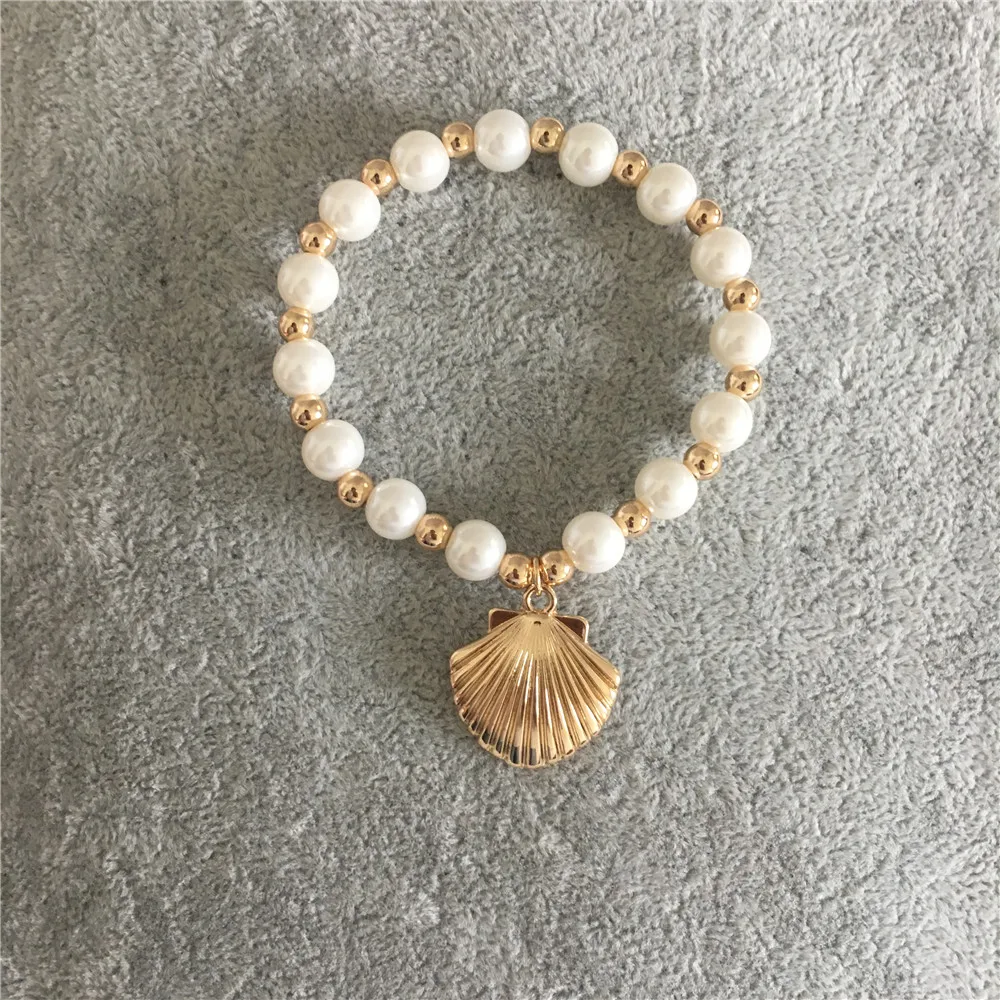 

FASHION JEWELRY LOVELY GOLD COLOR PLATING PEARL STRAND WITH SHELL STRAND BRACELET