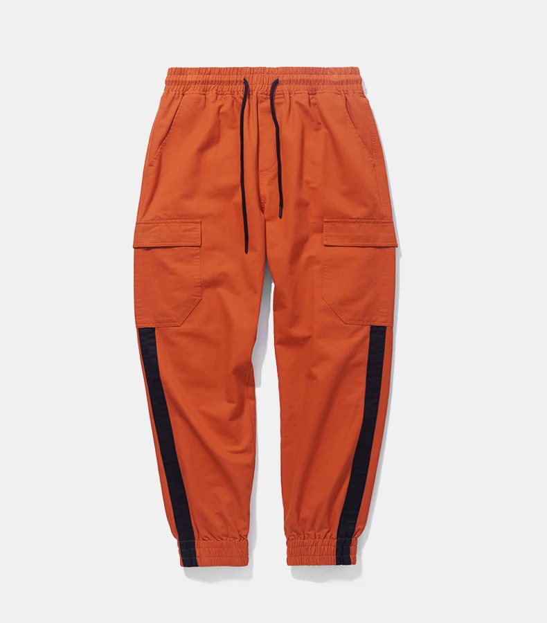 green and orange track pants