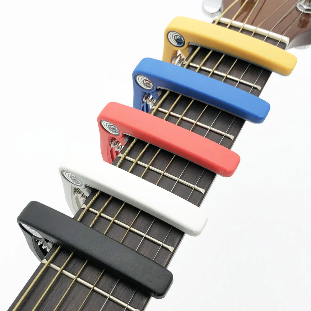 SLOZZ Guitarra de plástico de Capo 6 cuerdas eléctrica acústica Guitarra Bass Ukulele de abrazadera Capotraste Violao Accesorios SLOZZ Guitarra de plástico de Capo 6 cuerdas eléctrica acústica Guitarra Bass Ukulele de abrazadera Capotraste Violao Accesorios