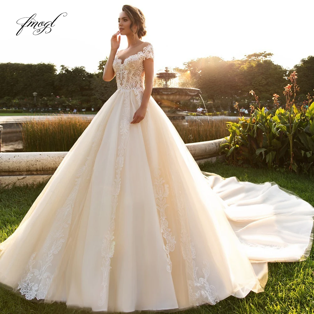 

Fmogl Sexy Backless Lace Princess Wedding Dresses 2019 Appliques Beaded Cap Sleeve Chapel Train A Line Vintage Bridal Gowns