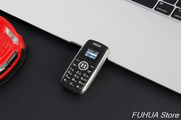 Милые Мини ключа автомобиля модель телефона Dual Sim карты Bluetooth соединение с функцией Magic Voice MP3 одним из ключевых Запись мобильный телефон