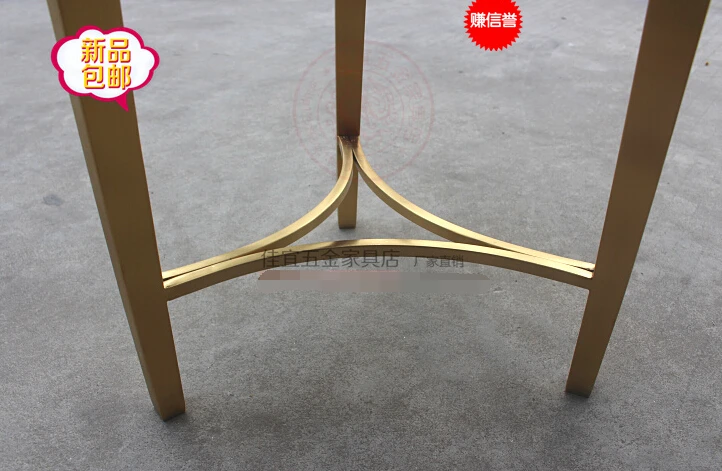 Stainless steel small round tea table.