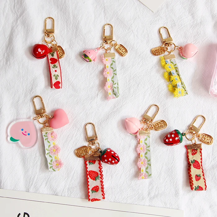 

1pcs Omamori sweet simulation strawberry bow ribbon Peach Bell key bag pendant Super Pretty key chain llaveros