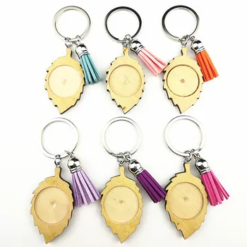 

Jiangzimei New 24pcs Leaves 25mm Wood Cabochon Stainless Steel Keychain Blank Wooden pendant with tassels Keyring Wholesale