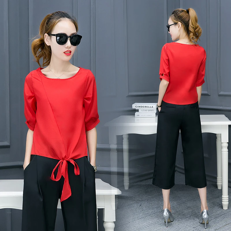 red blouse and black pants