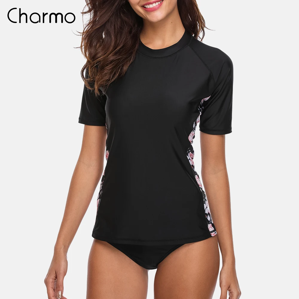 Charmo النساء قصيرة الأكمام Rashguard الأزهار طباعة تشغيل قميص ركوب الدراجات قميص تصفح أعلى ملابس السباحة طفح الحرس UPF 50 +